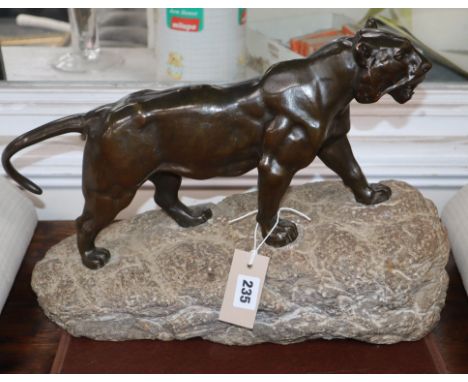 A bronze tiger, on stone base