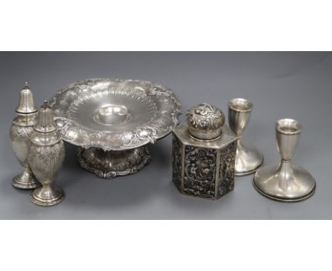 An American sterling tazza, a pair of sterling casters, a pair of sterling dwarf candlesticks and an embossed 800 white metal