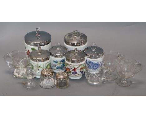 Six Royal Worcester large porcelain egg coddlers, eight smaller coddlers, two silver-topped bottles and five glass custard cu