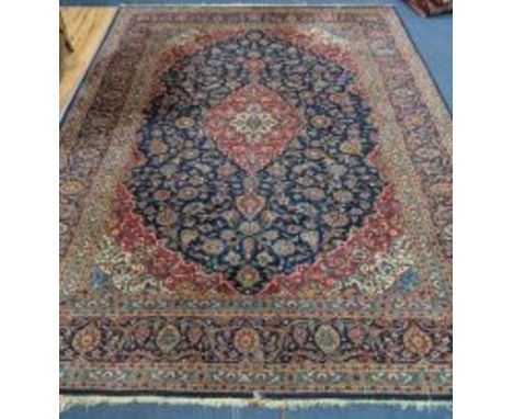 A Kashan style blue ground carpet 360 x 270cm