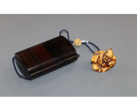 A Japanese hardwood three case inro with signed netsuke of a carpenter