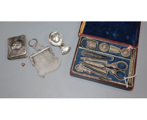 A filigree white metal-mounted sewing necessaire in fitted case and three other items, comprising a silver-mounted miniature 