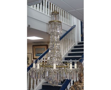 A facet cut twelve light ceiling chandelier