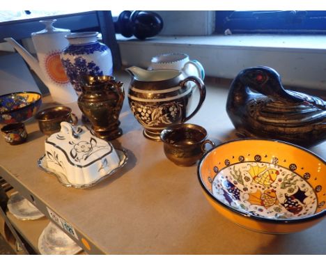 Shelf of mixed ceramics