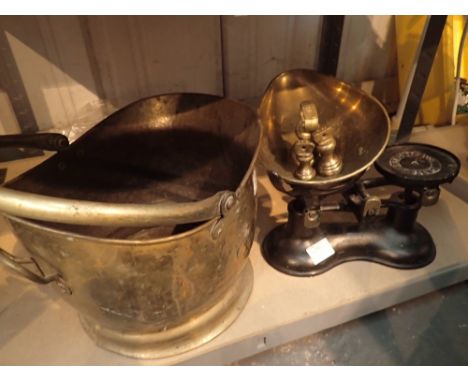 Set of cast iron scales with brass pans and a small brass coal scuttle 