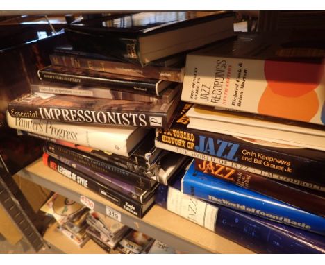 Shelf of mixed hardback books 