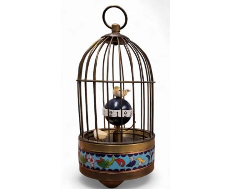 A novelty automaton clock, as a bird in a cage, cloisonne band, 21cm high