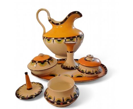 A Crown Devon Fielding's Art Deco wash jug, dressing table tray, pin holder and pots, each with alternating demi-circles and 