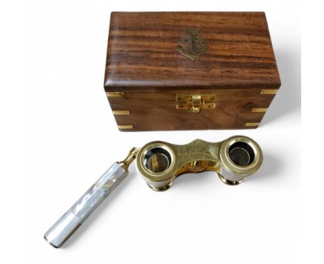 A pair of mother-of-pearl and gilt opera glasses, boxed
