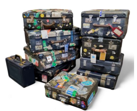 Interior Design - a stack of well travelled vintage luggage suitcases