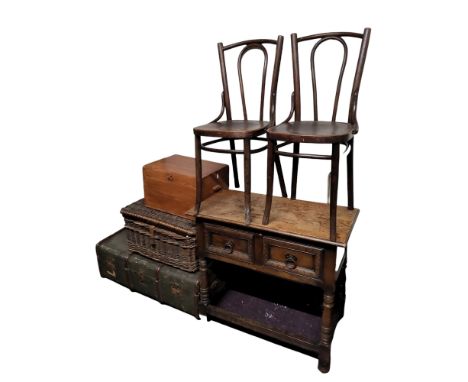 An early 20th century oak hall table, two drawers to frieze, Colonial type ironwork drop loop handles, turned legs, refectory