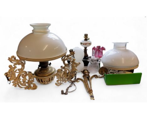 A British Made ceiling oil lamp, with white domed shade, the cast brackets with ladies, flowers and scrolls, 53cm high, c.191