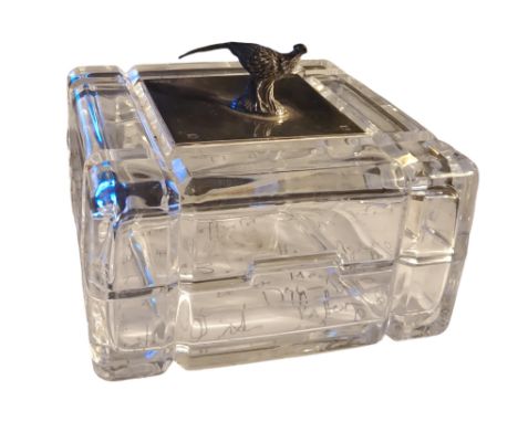 A silver mounted clear glass inkwell, of square form, surmounted with a pheasant, 9cm wide, Sheffield 2001