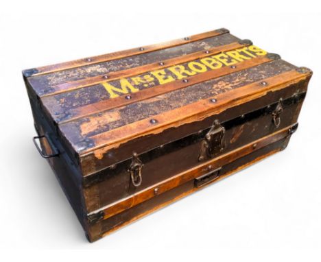 An early 20th century metal bound steamer trunk painted Mrs Robinson with contents, including a faux tortoise shell gilt meta