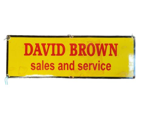 Advertisement - an original ' David Brown sales and service ' enamel sign relating to the tractor manufacturer, yellow red an