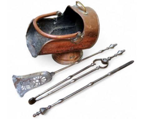 A set of George III polished steel fire irons including pierced shovel, tongs and poker, each finely worked with turned teard