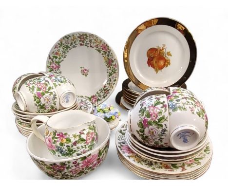A Crown Staffordshire tea service, for six, decorated with a colourful summer flowers, pattern 7117;&nbsp; etc