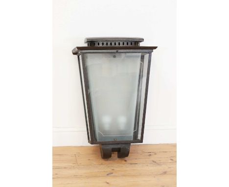 An Italian Art Deco wrought iron wall lantern,of tapering rectangular form, with original etched glass and inner frosted glas