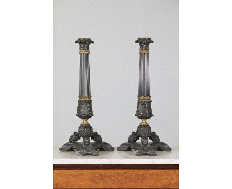A pair of Louis Phillipe spelter triform sinumbra lamp bases,mid-19th century, French, each reeded column with acanthus colla