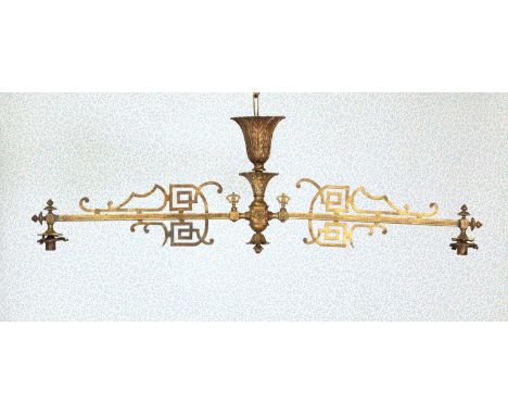 A Victorian brass gasolier,the central support cast as stiff leaves, the arms with chinoiserie decoration, supporting two opa