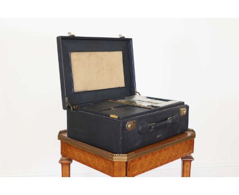 A Gucci Florentine leather dressing case,inscribed in gilt 'A.D.V.', the kid-leather-lined interior with a fitted lift-out tr