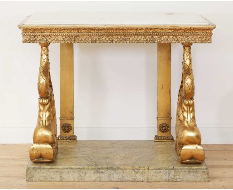 A Swedish Gustavian giltwood console table,c.1800, the white marble top over an ornately worked 'fish scale' carved frieze, s