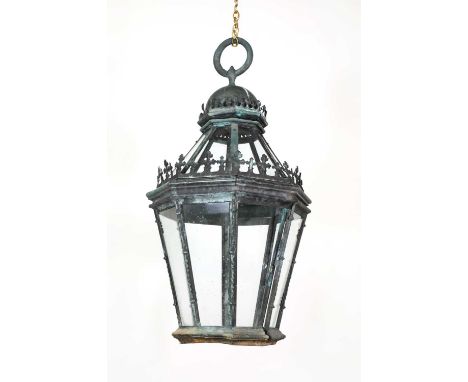 A large copper gas lantern in the Gothic taste,late 19th century, the octagonal tapering body surmounted by stylised crosses 