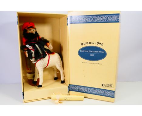 Steiff - A boxed limited edition Hungarian Felt Doll with Horse # 411984. It is a 1996 replica of the 1912 original. It appea