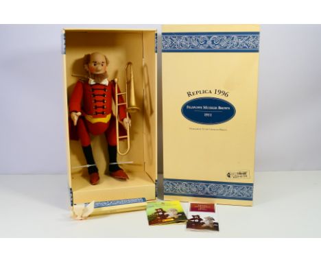 Steiff - A boxed limited edition Felt Musician doll in brown, a 1996 replica of the 1911 original. The doll appears Mint with