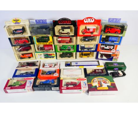 Lledo - Corgi - A group of boxed models including Dennis F8 Fire Engine, AEC Tanker, Jaguar XK120, Bedford Military Ambulance