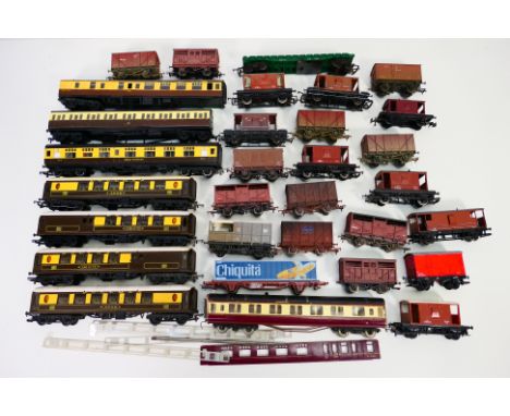 Tri-ang - Hornby - Jouef - Dapol - A collection of unboxed OO gauge rolling stock including wagons and coaches, some in a wea