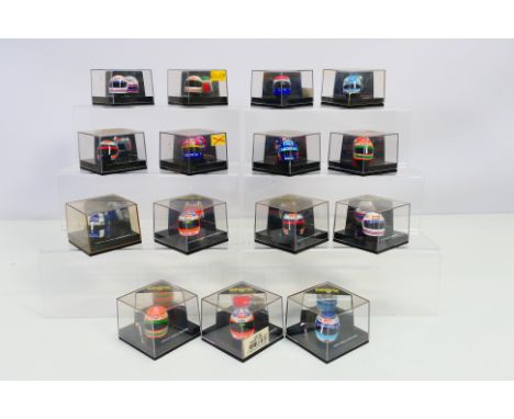 Onyx - A collection of 15 boxed diecast 1:12 scale racing helmets from Onyx. Lot includes Onyx HF013 Martin Brundle; HF026 Da