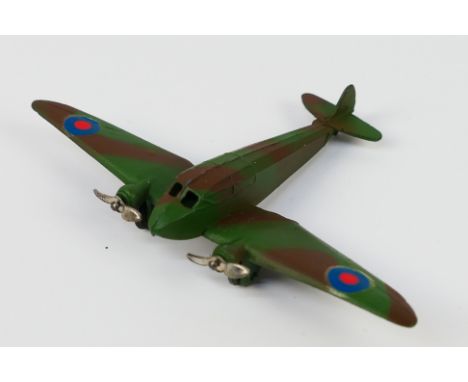 Dinky Toys - An unboxed pre-war Dinky Toys 66e Medium Bomber. The model in camouflage one with RAF blue roundels plus two 2-b