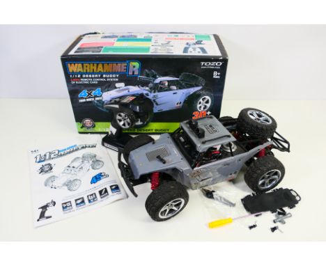 Warhammer by Tozo - a 1/12 scale Desert Buggy, 2.4 GHz remote control system 4 x 4 four wheel drive - appears ex with light u