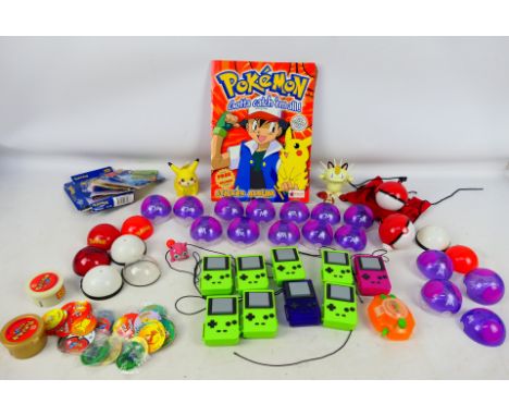 Pokemon - A collection of Pokemon related toys, stickers and ephemera. Lot includes an incomplete Merlin Pokemon Series 1 Sti