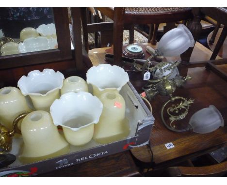 A BRASS THREE BRANCH CEILING LIGHT, two brass wall lights and seven various glass shades (10)