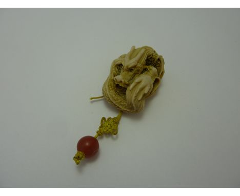 A NETSUKE, depicting two entwined dragons