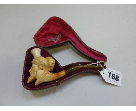 A MEERSCHAUM PIPE, carved with the head of an Arab, fitted case