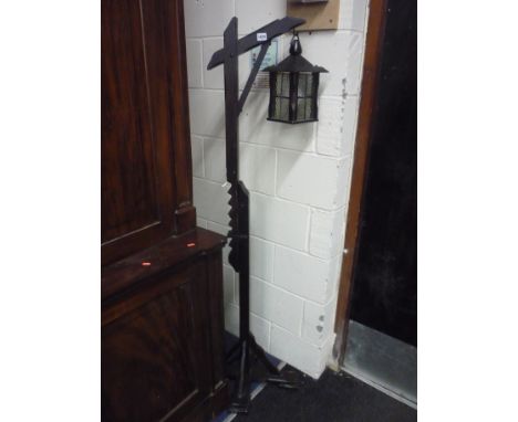 AN OAK HANGING LANTERN, on adjustable support