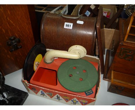 A CASED 'ALL' CHILDS SEWING MACHINE, with a part boxed Chad Valley tinplate childs toy gramophone and two records (2)