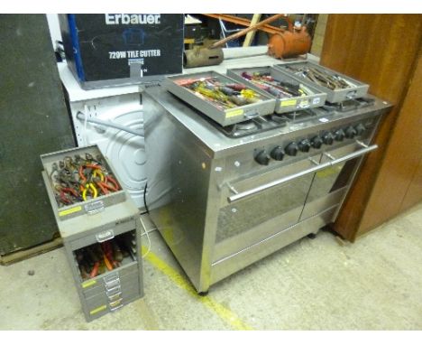 A METAL TEN DRAWER FILING CABINET, with various hand tools including screwdrivers, pliers and allen keys