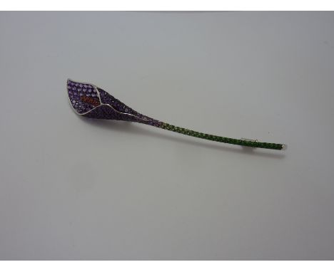 ASPREY - AN 18CT GOLD BROOCH, within the shape of a cala-lily, with amethysts, orange and violet sapphires together with a ts