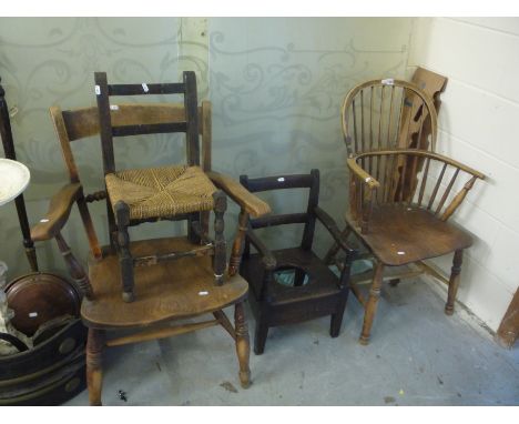 A WINDSOR CHAIR, with elm seat, kitchen armchair, childs chair and a childs commode chair (s.d.) (4)