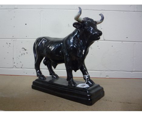 A CERAMIC FIGURE OF A BULL, (horns s.d.), height 24cm