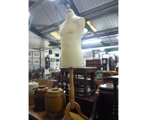 A MALE TORSO SHOP WINDOW MANNEQUIN, on tripod support