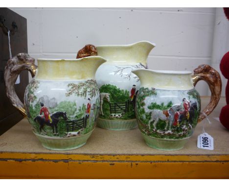 A SET OF THREE GRADUATING WEDGWOOD 'HUNTING' SCENE JUGS, (3)