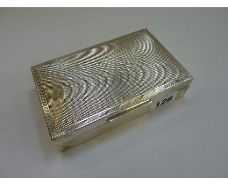 A SILVER TABLE CIGARETTE BOX, engine turned decoration, London 1973