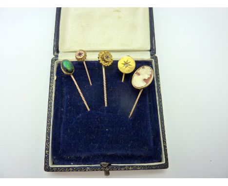 FIVE STICKPINS, to include an opal stick pin, a cameo stickpin depicting a woman in profile, together with three similarly de