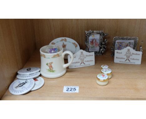 A collection of Royal Doulton Bunnykins items to include enamel pill boxes , silver plated bunnykins moulded photoframes , va