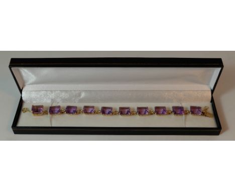 Gold and amethyst bracelet, 15ct or higher unmarked gold bracelet set with 10 amethyst stones, (approx 50 carat)
